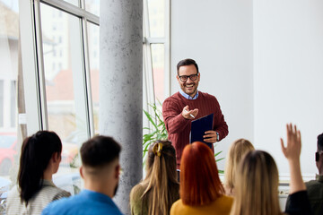Teacher Conducting Interactive Lecture With Students in a Bright Classroom Setting