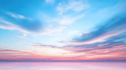 Obraz premium Panoramic view of the sky during sunset with blue hues above pink reflecting on a water surface