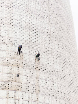 Industrial climbers clean the outside of the building at cfc Casablanca morocco 