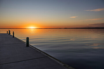 Fototapeta premium Different views of the sunset over Lake Eustis in Eustis, Florida