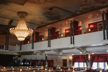 Grand ballroom and Show Lounge or theatre with stage and seating on Belle Époque design cruiseship...
