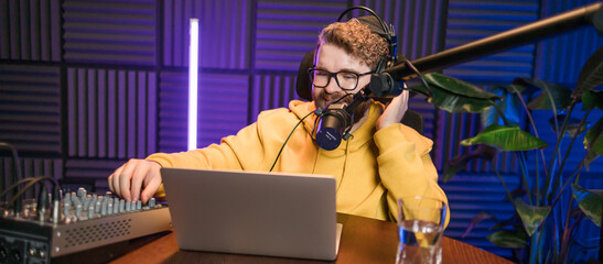 Banner Handsome man radio DJ hosting a radio show, entertainment and communication concept. Copy...