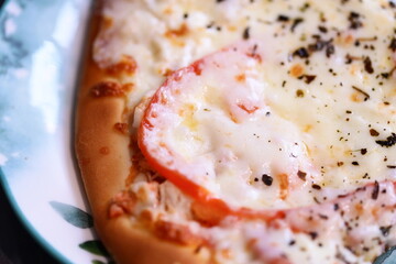 A close-up shot of a delicious-looking pizza on a plate, perfect for food or travel photography.