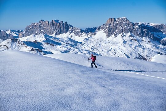 Young woman on a ski tour in the Madrisa Luzein area. The Drusenfluh and Sulzfluh peaks are in the background. Ski mountaineering in Graub&uuml;nden. Skitour through deep snow. High quality photo.