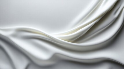 Obraz premium Soft, flowing white fabric drapes. Detailed close-up of smooth, elegant folds
