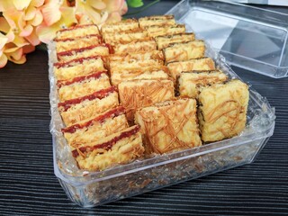 A box of mix cheese bar in different flavour like pineapple, strawberry and blueberry. Popular cookies for celebration of Eid Mubarak (Hari Raya). Malaysian famous dessert for Hari Raya