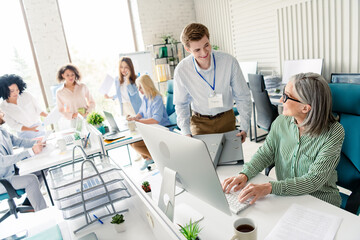 Professional team working together in a modern office environment emphasizing cooperation and dynamism