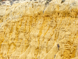 Rocky cliffs in sand from Galé beach in Melides in the municipality of Grandola.