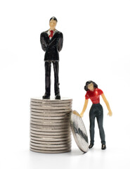 Miniature doll toy of a person and a coin