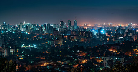 Night view of Bangalore cityscape with glowing lights and haze.