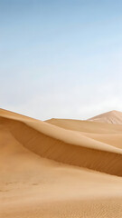 Soft golden sand dunes stretching into the distanc