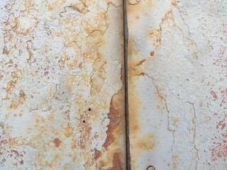 Rusty wall surface with vertical stain for aged effect in design and education projects