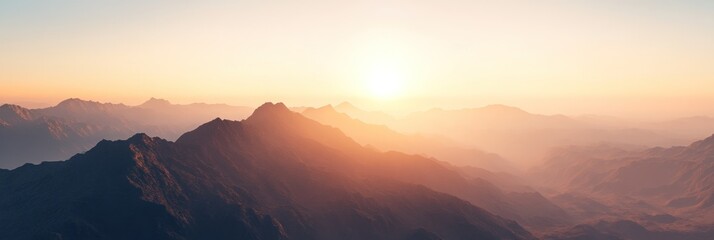 Sunrise over a misty mountain range