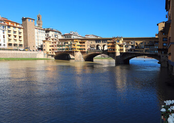Obraz premium Famous bridge called PONTE VECCHIO in italian city of FLORENCE and Arno River