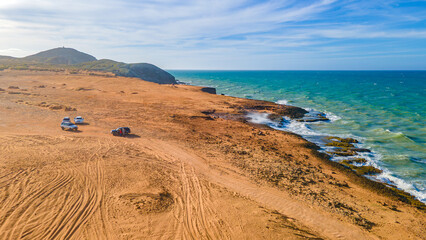 Scenic Coastal Landscape at Cabo de la Vela, La Guajira, Colombia with Vibrant Blue Waters and Sandy Terrain