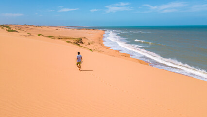 Obraz premium Serene Walk Along Taroa Dunes in La Guajira, Colombia: A Coastal Paradise