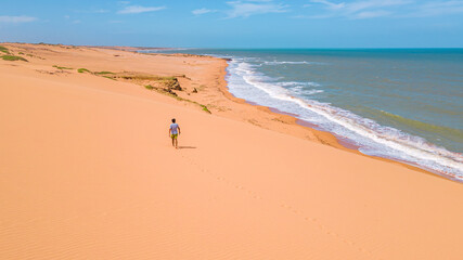 Stunning View of a Solitary Walker on the Sand Dunes of Taroa, La Guajira, Colombia