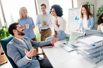 Business team engaging in lively collaboration at modern office environment