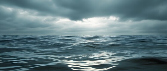 Fototapeta premium Serene and contemplative image of rippling waves in a gray ocean under an overcast atmospheric sky with a moody cinematic lighting effect