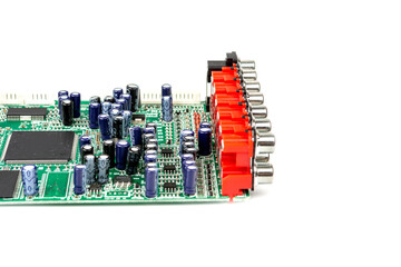 A close-up of the processor microchip surrounded by other electrical components on a green circuit...