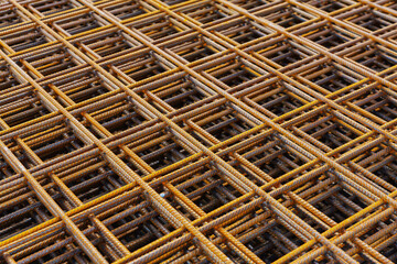  Stacked steel rebar grids for construction projects showing industrial texture and structural foundation detail