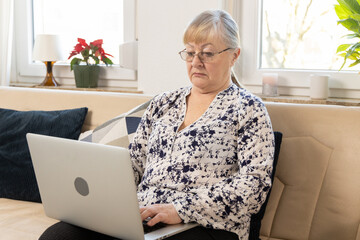 Government Pension Retire Concept, Elderly Person Engaging in Digital Interaction Using Laptop,...