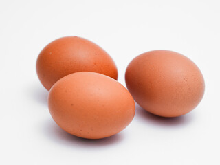 Fresh chicken eggs on a white background. Perfect for projects related to food, healthy eating, cooking, farm products, and advertising