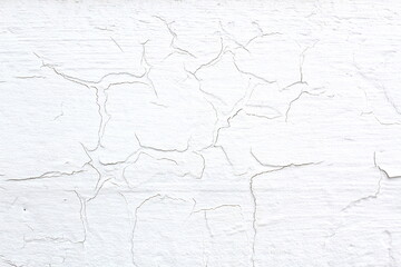  Texture of cracked painted plaster on a wall.