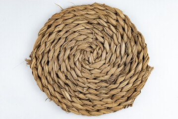 Seagrass and marine fiber trivet with natural design and unique texture, close-up view