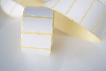 Rolls of white labels isolated. Labels for direct thermal or thermal transfer printing. Blank...
