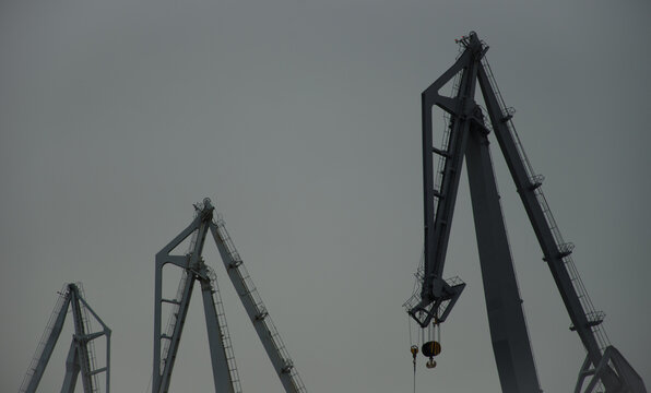 Luffing cranes in the port of Ferrol. A Coruna. Galicia. Spain.