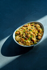 Prepared fried rice in a bowl, fried rice served in a white bowl, typical Asian fried rice dish, healthy homemade fried rice