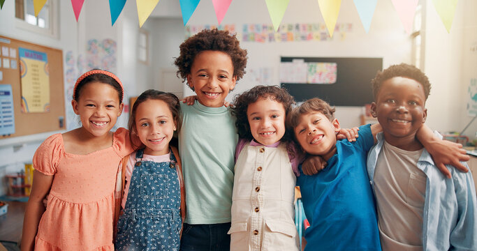 Portrait, education and hug with students in classroom for child development, future and learning. Academy, growth and scholarship with group of kids in school for knowledge, lesson and study