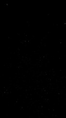 Freeze motion of dust particles flying , isolated on black background