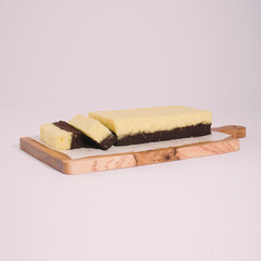 cheese brownies on a wooden tray