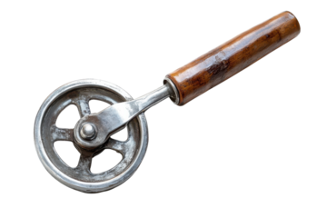 A culinary craftsman's secret weapon a vintage pastry wheel cutter used with generations full of love and care against a dark minimal background