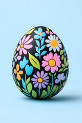 Decorated Easter egg with pastel floral design on black background