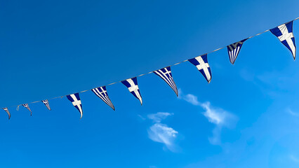 Greek Flags Hanging On A String Against A Clear Blue Sky, Waving In The Wind, National Symbol Of Greece, Patriotic Celebration, Cultural Heritage, Festive Atmosphere, Ideal For Tourism And Events.