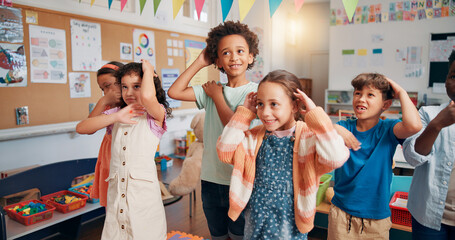 Learning, dance and group of children in classroom together for coordination or motor skills development. Education, music or study with boy and girl students in school for scholarship as friends