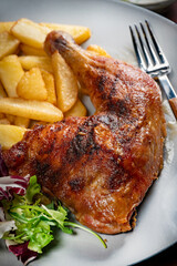 Appetizing baked chicken leg quarter.