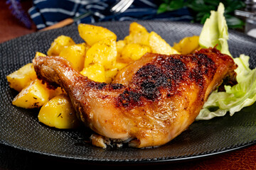 Appetizing baked chicken leg quarter.