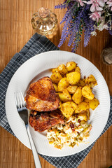 Appetizing baked chicken leg quarter.