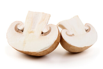Fresh cremini mushrooms whole and sliced isolated on white background.