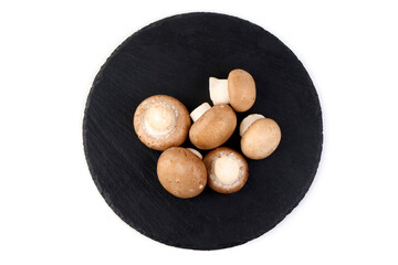 Fresh cremini mushrooms whole and sliced isolated on white background.