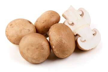 Fresh cremini mushrooms whole and sliced isolated on white background.
