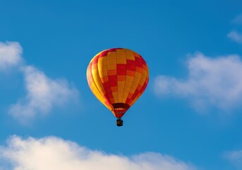Naklejka premium Colorful hot air balloon soaring against a clear blue sky