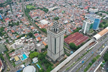 Jakarta, Indonesia - June 11, 2022: Aerial view of Saidah Tower, an old abandoned building located in South Jakarta