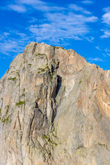 Brevent mountain summit in Chamonix valley. Rocky mountain top with cable car famous for climbing, hiking and paragliding from its slopes. Brevent summit in the Alps on a sunny day