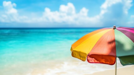 Colorful Beach Umbrella on Sand with Turquoise Sea and Cloudy Sky