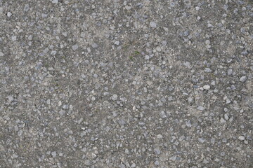 A grey and white background with a few rocks scattered around